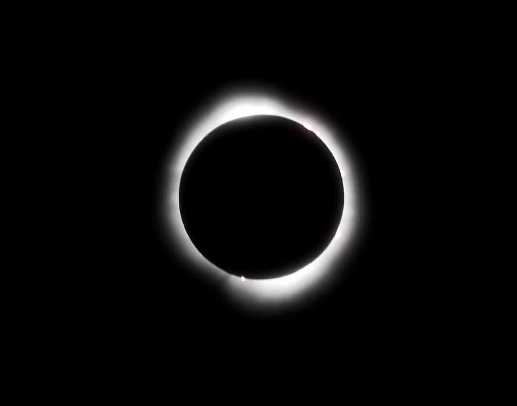 Photo of a solar eclipse at totality.