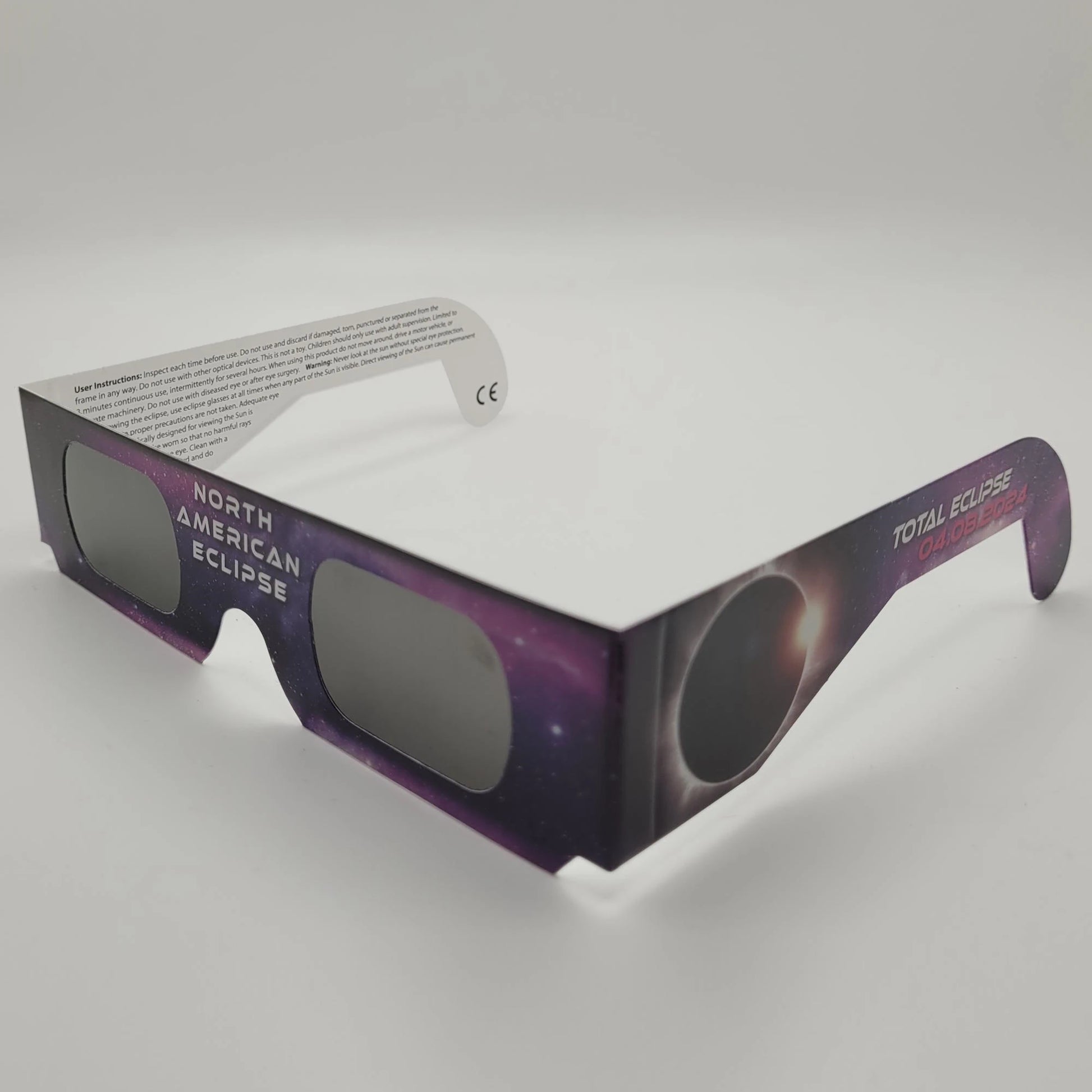 A single pair of purple solar eclipse glasses.
